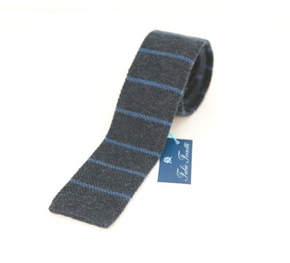 Picture of Knitted tie in blue background
