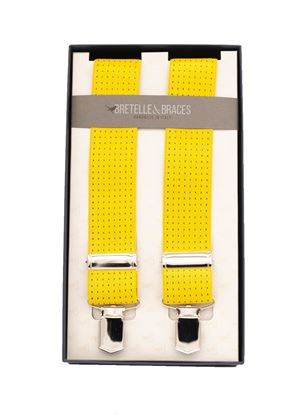 Picture of elastic braces with polka dots and yellow background